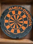 Dartboard Harley Davidson Black &orange 18" / Wood Cabinet. Fixed Price $100.00.